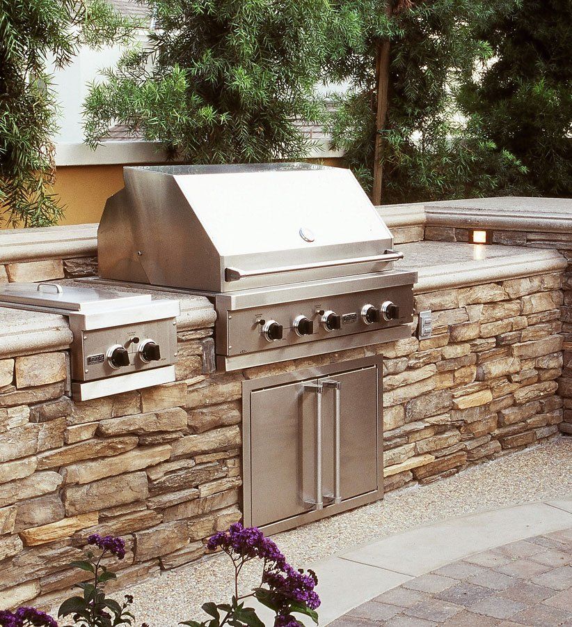 Stone veneer Bainbridge Ohio outdoor kitchen with built in grill
