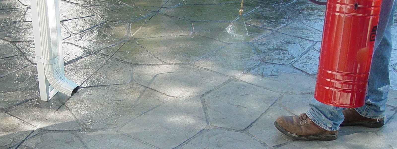 Shear waterfall curtain  scupper water feature in Ohio backyard patio.