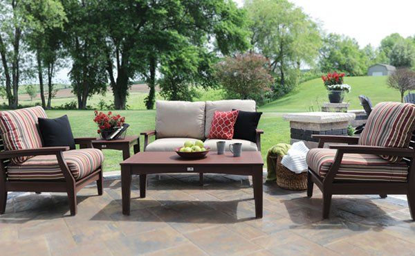 Backyard garden amish poly lumber outdoor furniture set with coffee table, loveseat, and deep seated chairs.