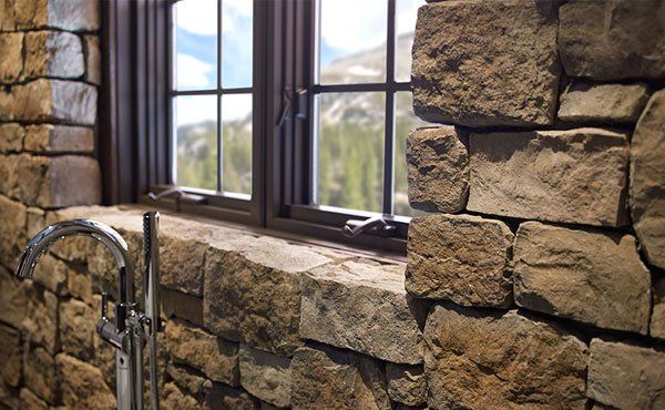 Faux cultured stone veneer in Ohio bathroom near the window.