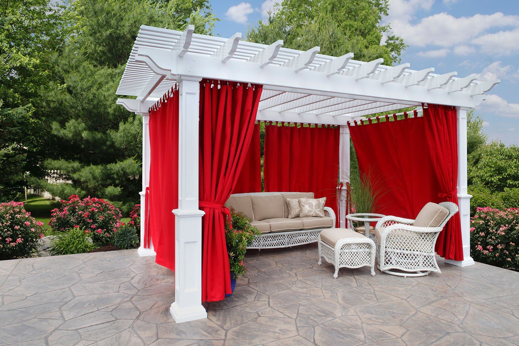 Dusk in a Rocky River Ohio backyard with vinyl pergola, curtains and outdoor poly furniture
