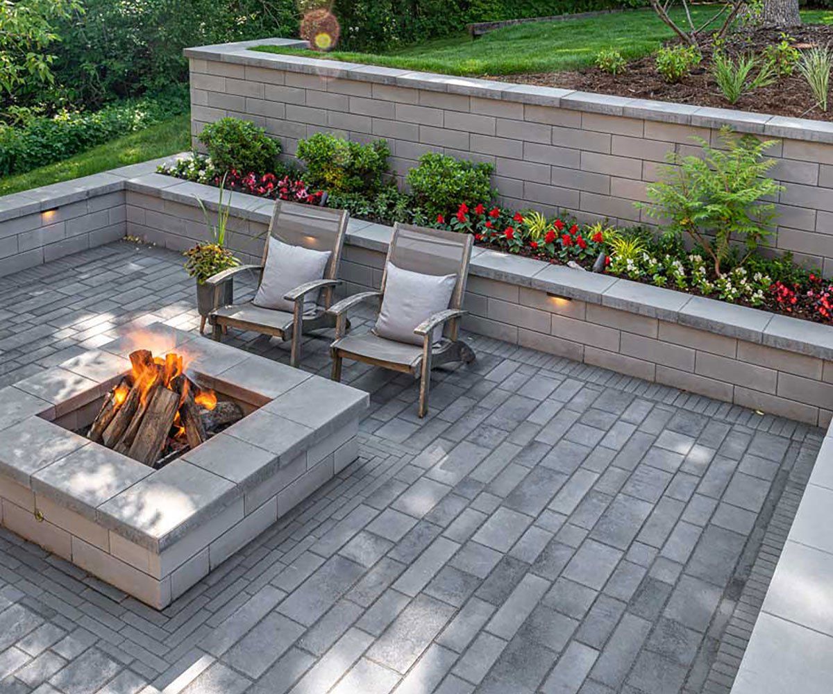 Retaining Wall and Fire Pit Outdoor fire pit and Ohio garden retaining wall made with Unilock pavers
