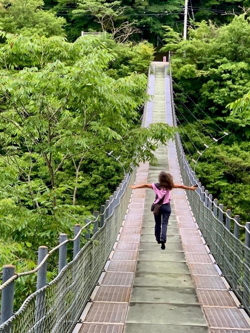 Portrait of Monique Stauder feeling the beauty of nature while exploring Japan in June 2024