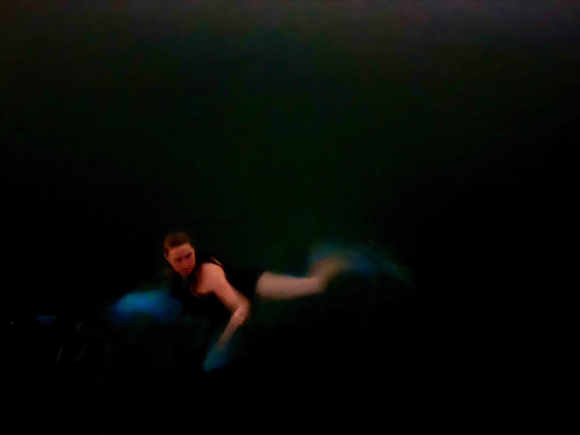 Poetic portrait of a swimmer in Puerto Rico’s bioluminescent bay.