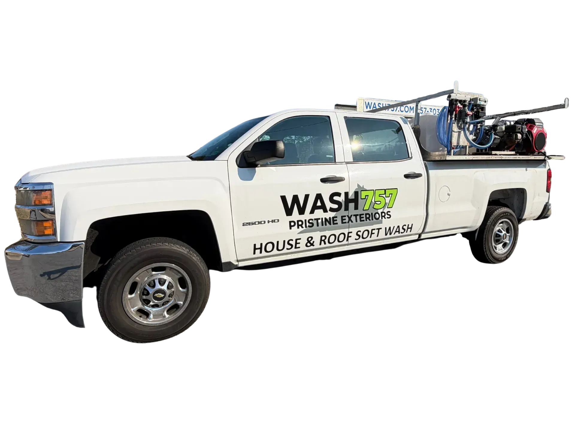 White service pickup truck with “WASH” and “House & Roof” signage, carrying ladders and equipment on top