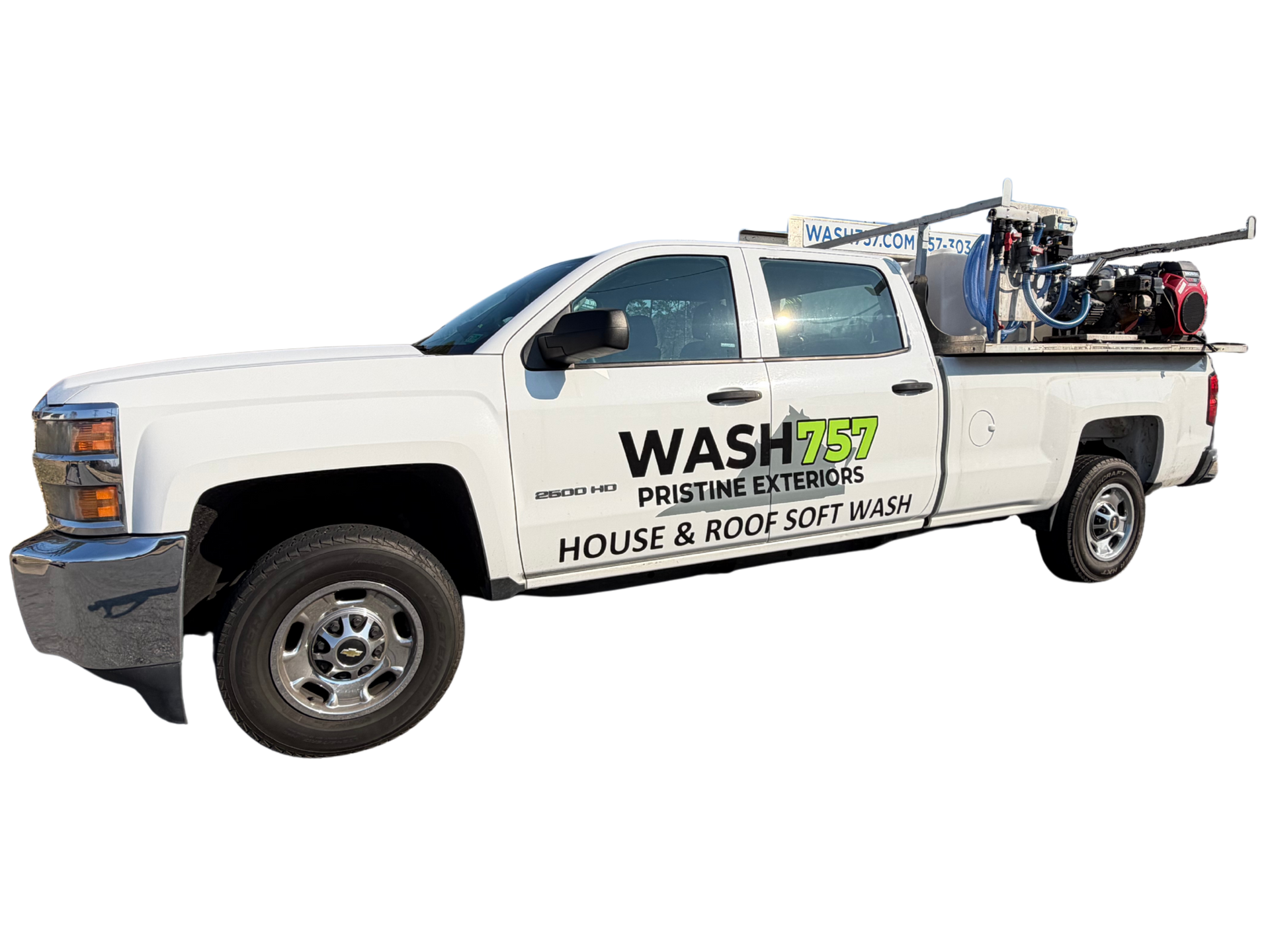 White service pickup truck with “WASH” and “House & Roof” signage, carrying ladders and equipment on top