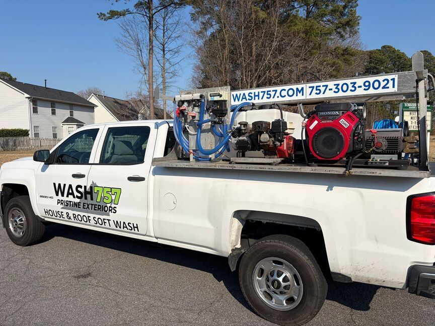 White Wash 757 service truck with pressure washers parked on a residential street, logo and phone number visible