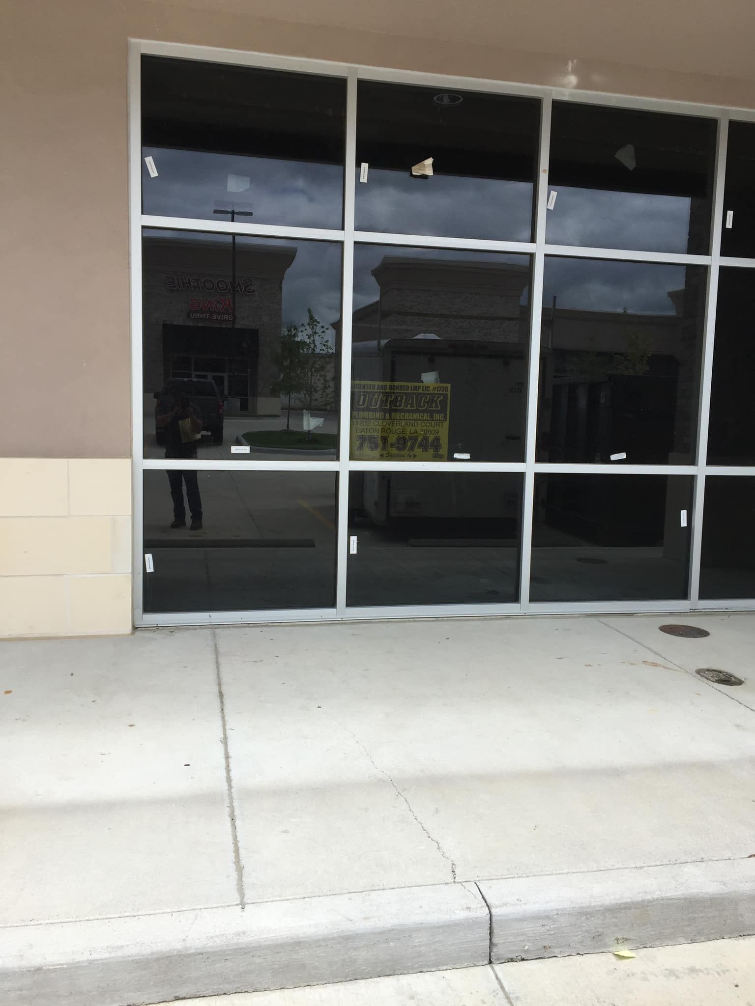 A building with a sign that says ' for sale ' on it
