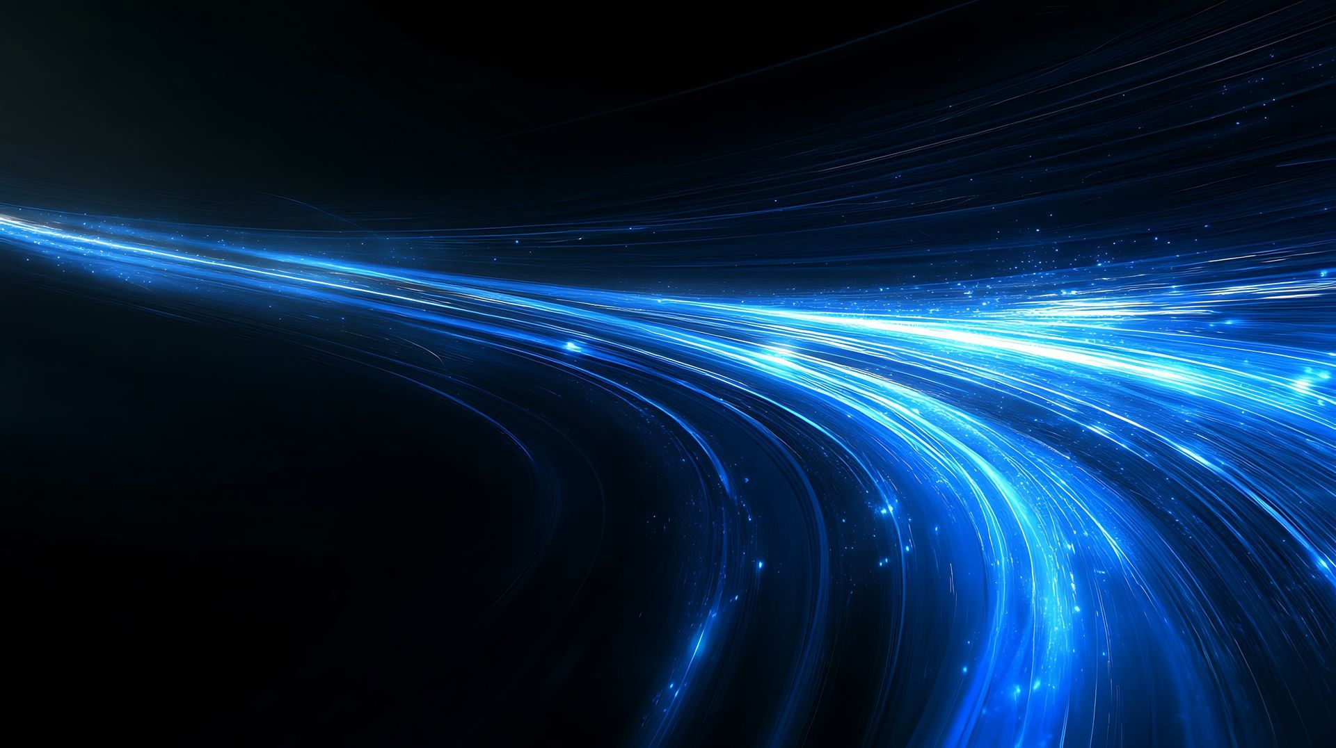Blue light trails curving across a dark background.