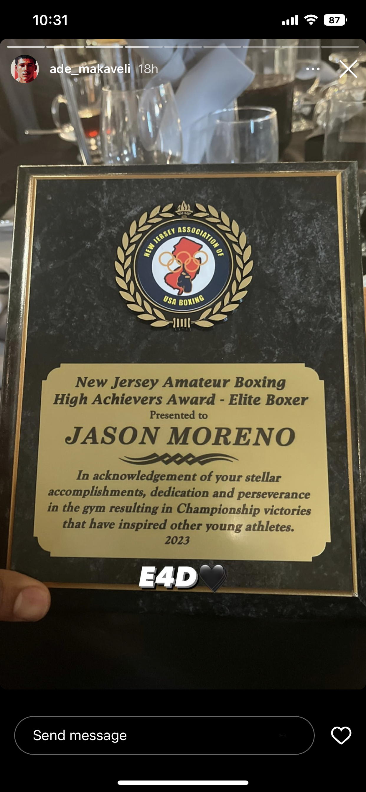 A person is holding a plaque that says jason moreno on it.