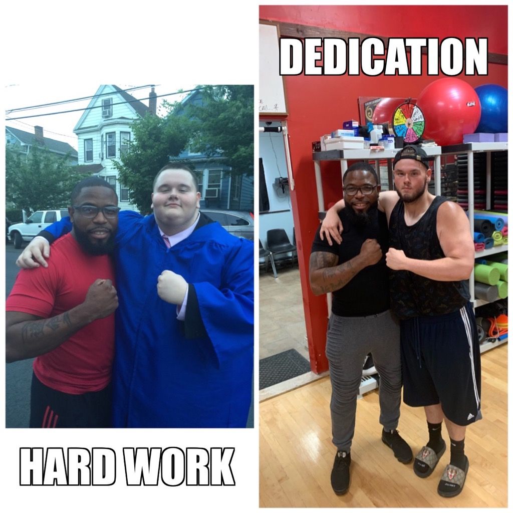 A man in a graduation cap and gown poses with another man in a gym