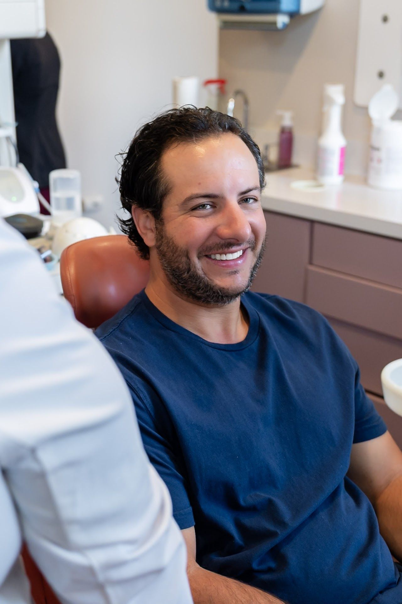 Smiling patient in the dental chair at Cocozzo Family Dentistry in Malta, NY