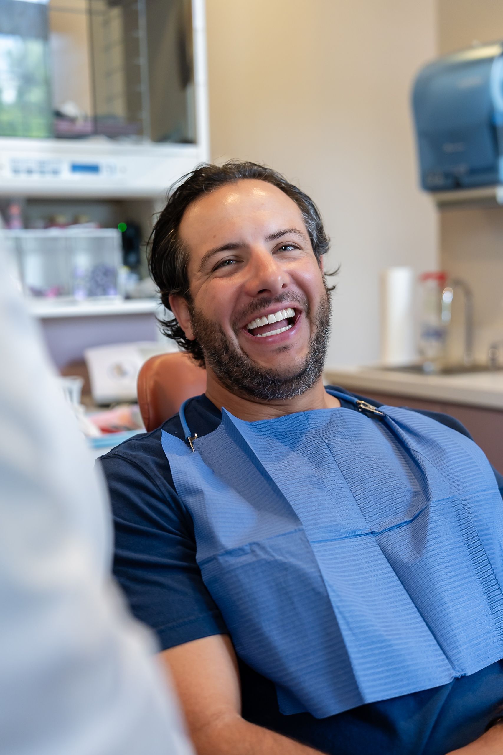 A smiling patient in the dental chair at Cocozzo Family Dentistry in Malta, NY