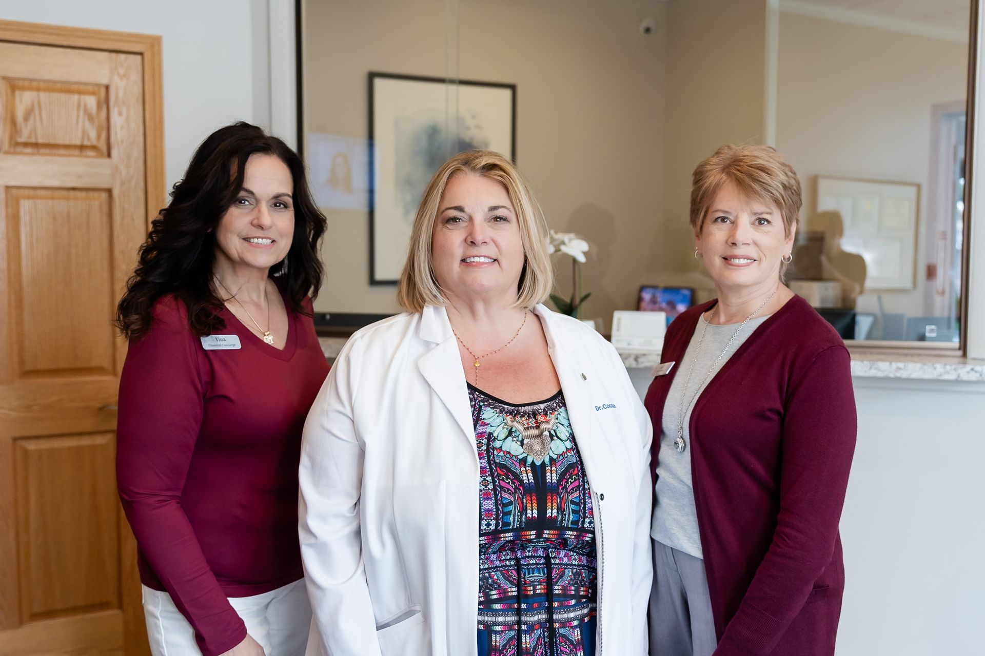 Dr. Christina Cocozzo with two team members at her Malta, NY office