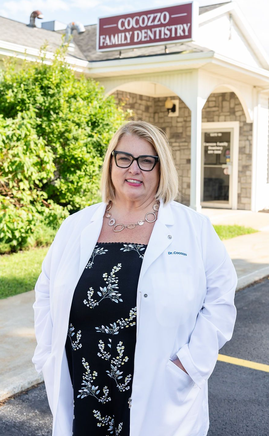 Dr. Christina Cocozzo outside Cocozzo Family Dentistry in Malta, NY