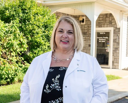 Dr. Christina Cocozzo outside Cocozzo Family Dentistry in Malta, NY