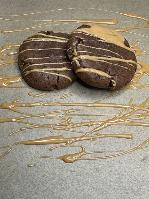 Chocolate based cookie with peanut butter filling in the center