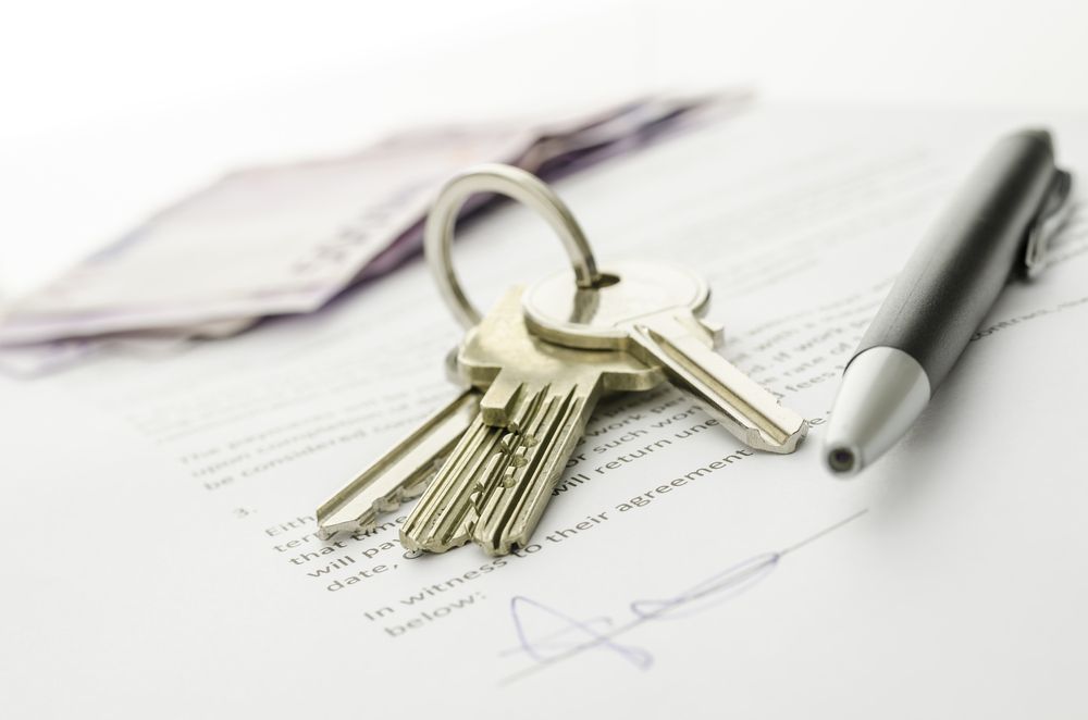 A Bunch of Keys and a Pen on Top of a Signed Document — Key2 Conveyancing In Tuncurry, NSW