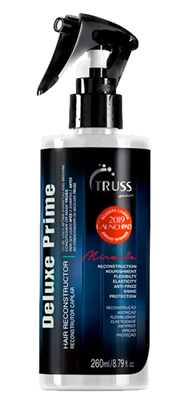 A bottle of truss deluxe prime hair reconstructor spray on a white background.