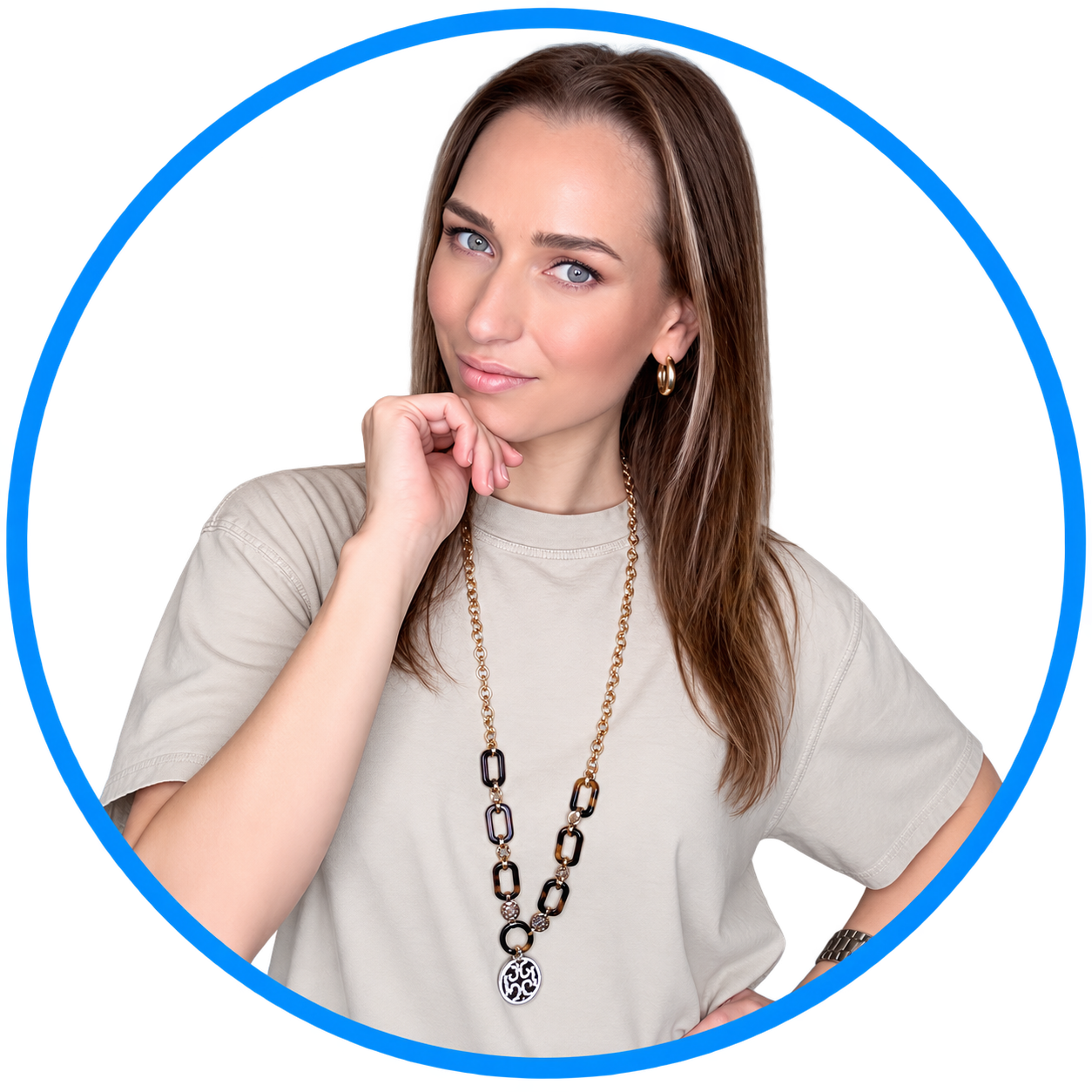 Blue 22 Salon & Spa Woman posing against a white background, wearing a beige shirt and long necklace with a blue circular border.