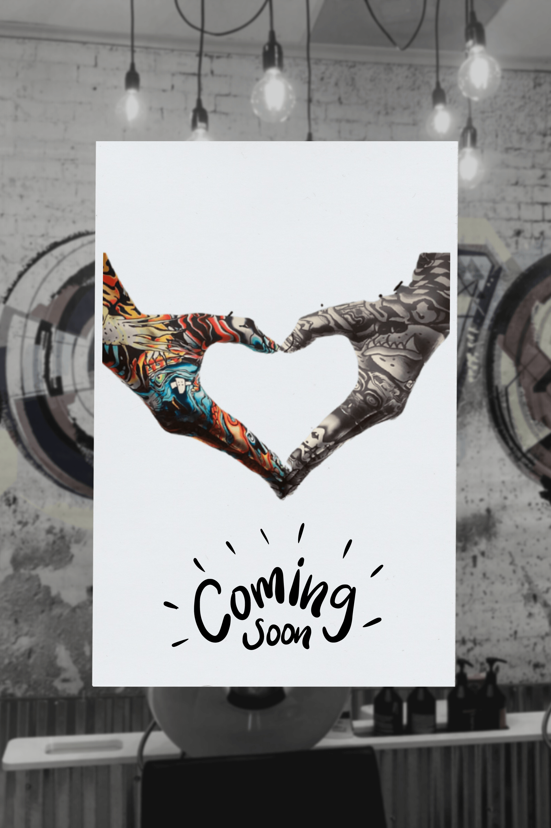 Hands forming a heart above a white poster that says “Coming Soon.”