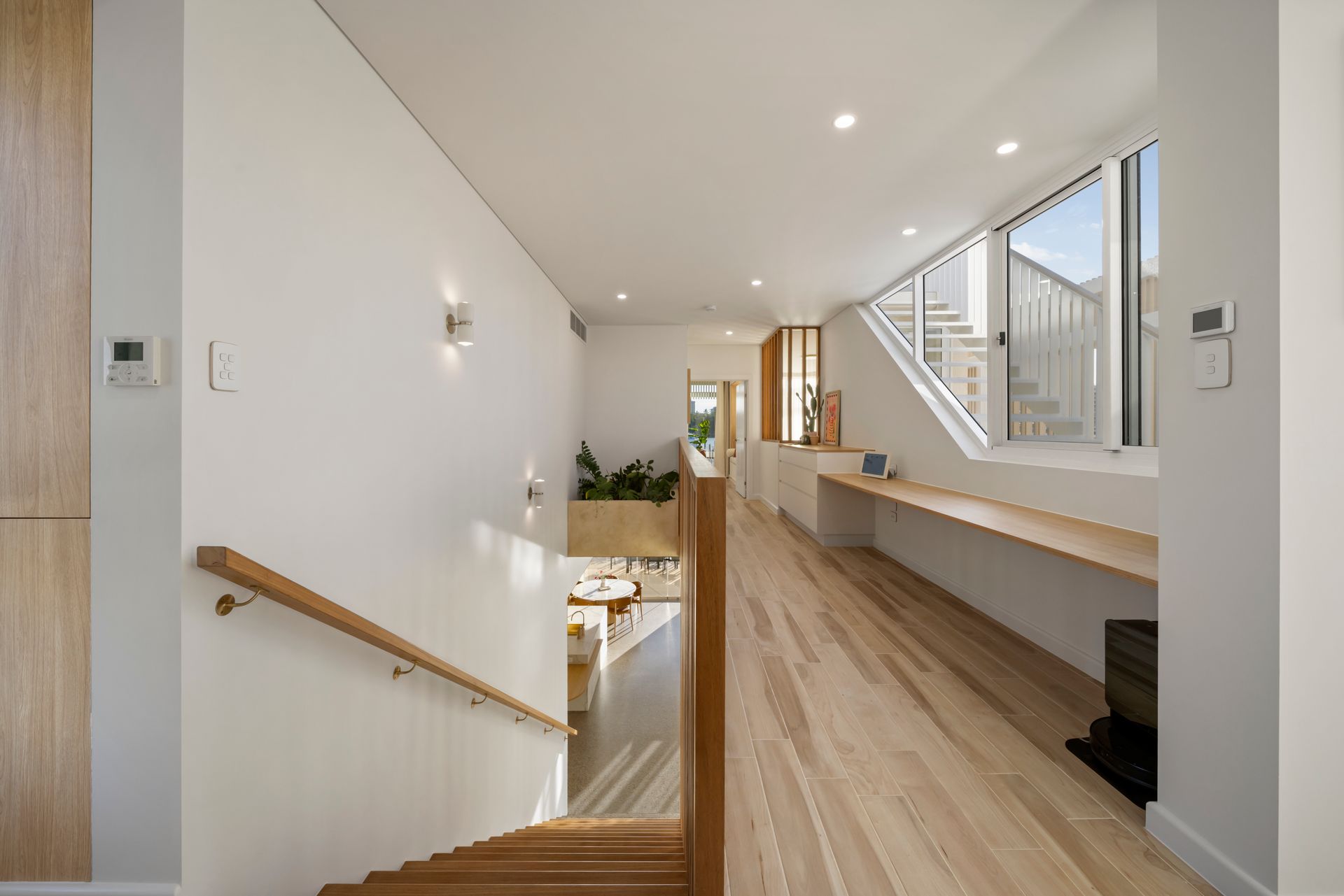 Bright Modern Hallway With a Wooden Staircase — Simon Bell Constructions in Alice River, QLD