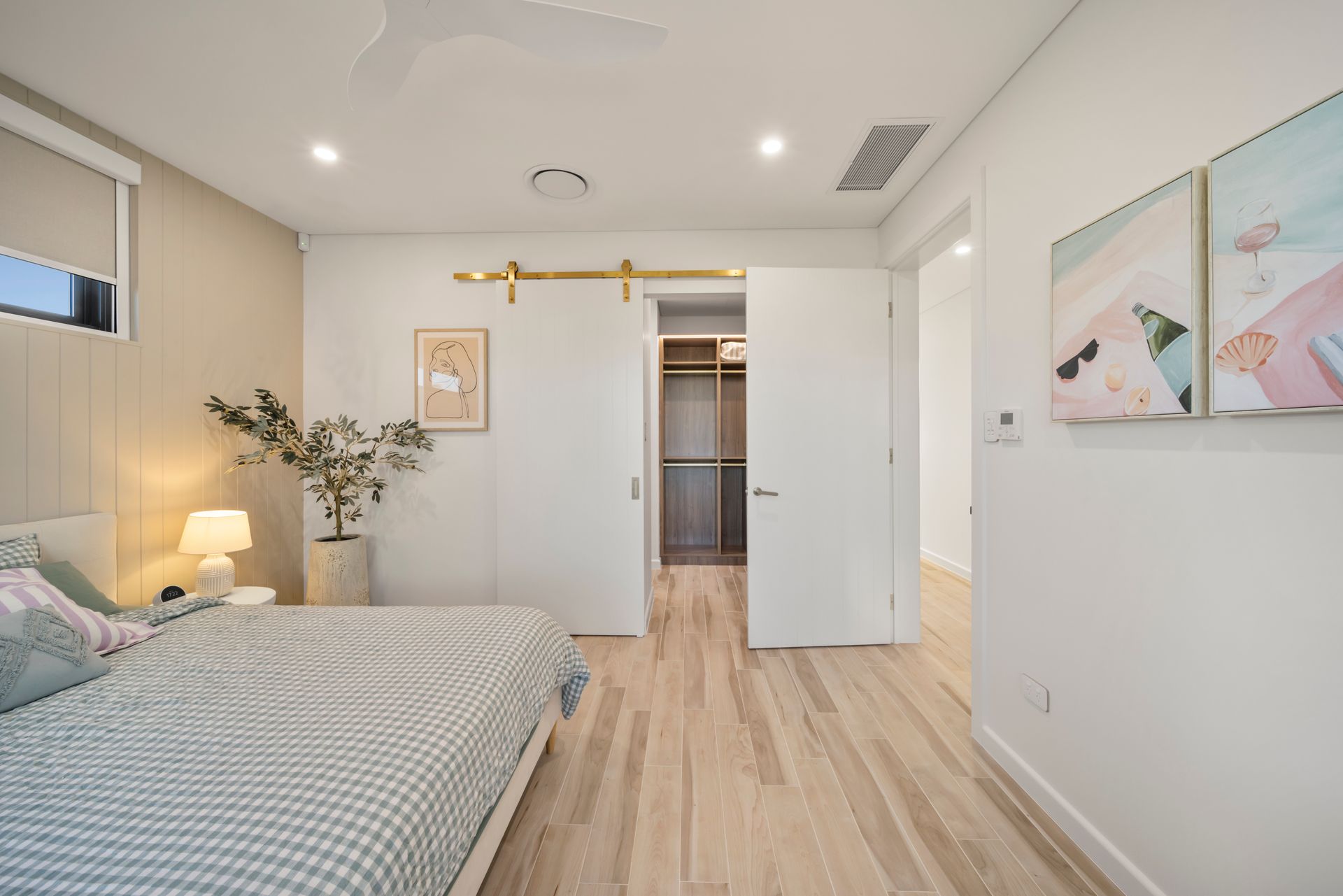 Bright Minimalist Bedroom With Light Wood Floors — Simon Bell Constructions in Alice River, QLD