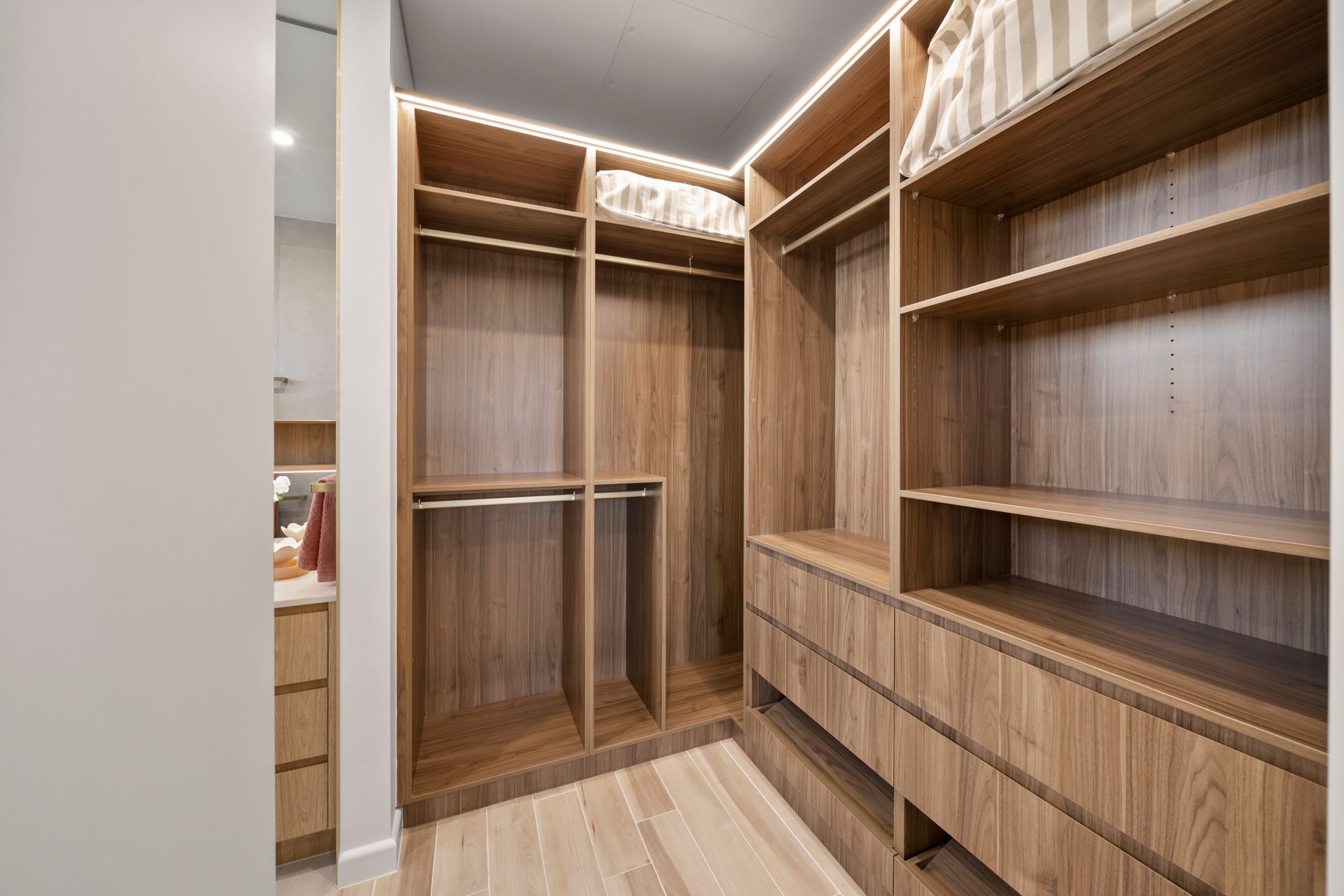 Empty Walk-in Closet With Built-in Wooden Shelves — Simon Bell Constructions in Alice River, QLD