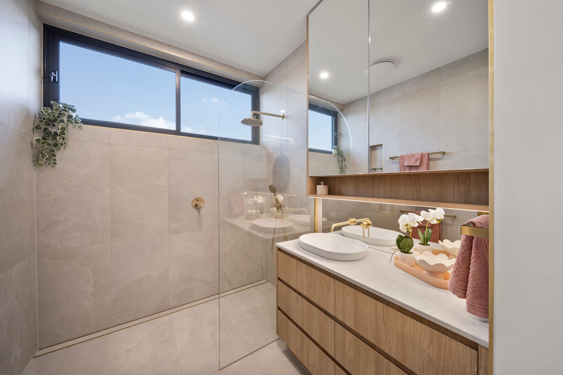 Bright Modern Bathroom With a Glass Shower — Simon Bell Constructions in Alice River, QLD
