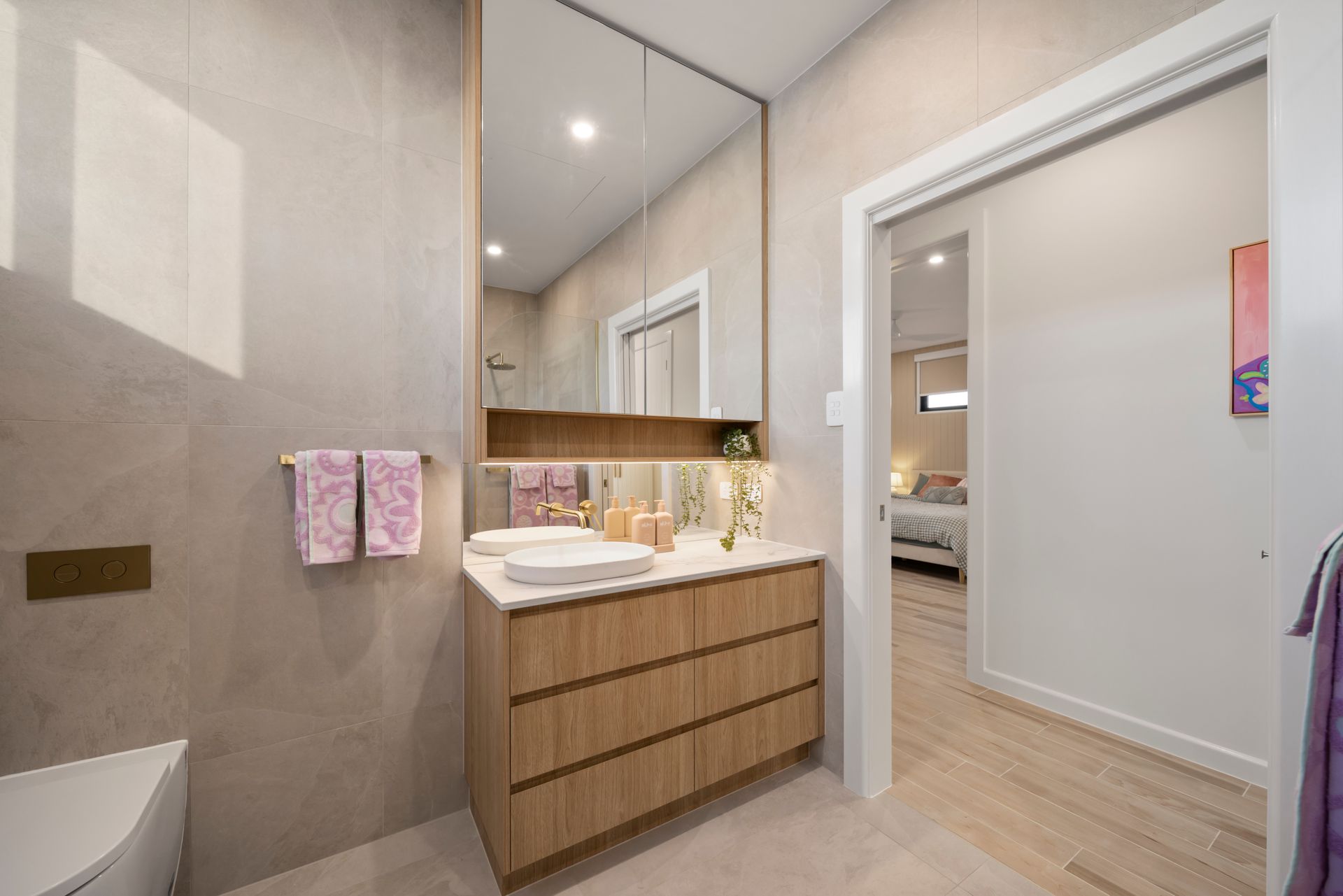 Modern Bathroom With Floating Wood Vanity, Large Mirror — Simon Bell Constructions in Alice River, QLD