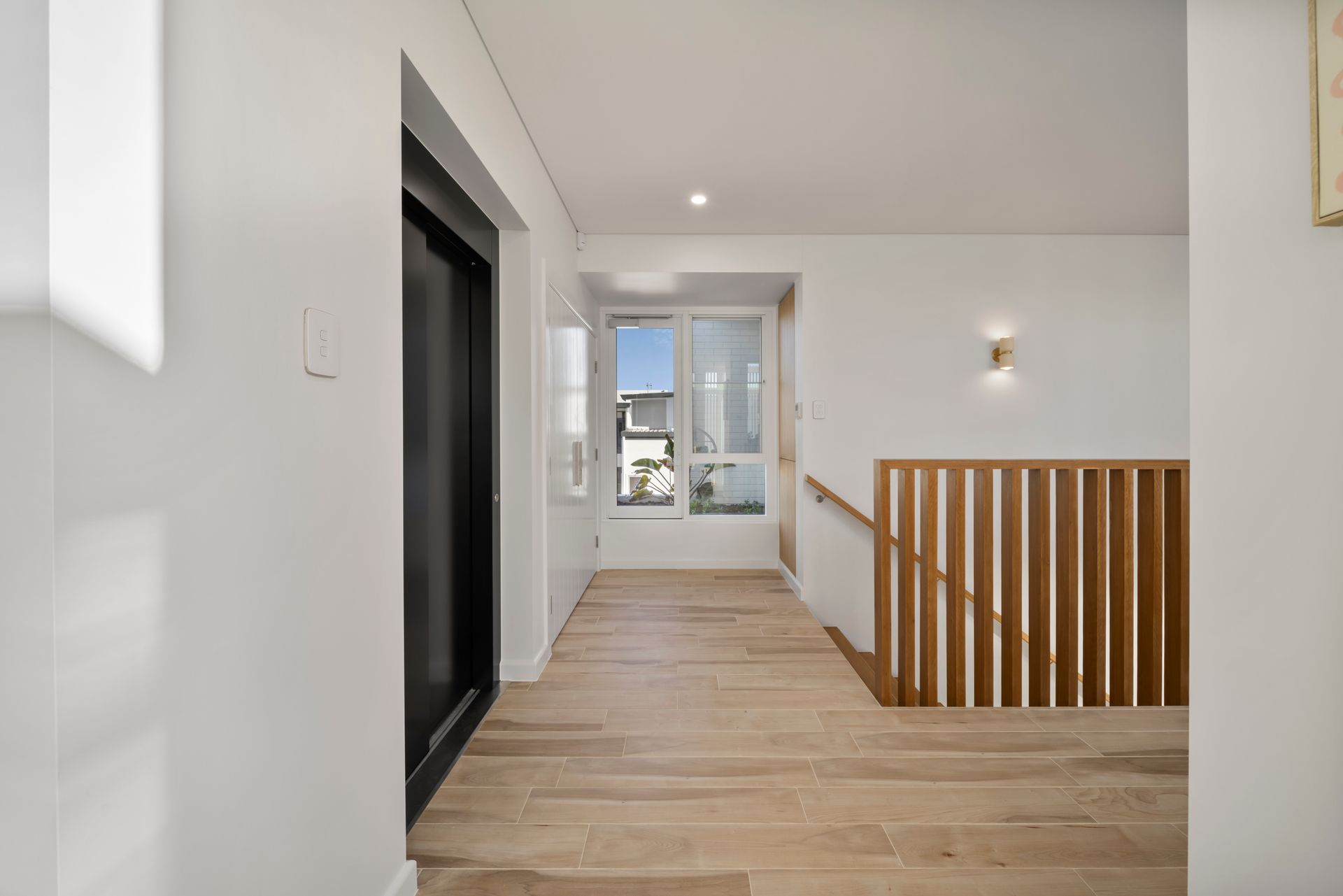 Modern Hallway With Light Wood Floors, White Walls, Staircase Railing — Simon Bell Constructions in Alice River, QLD
