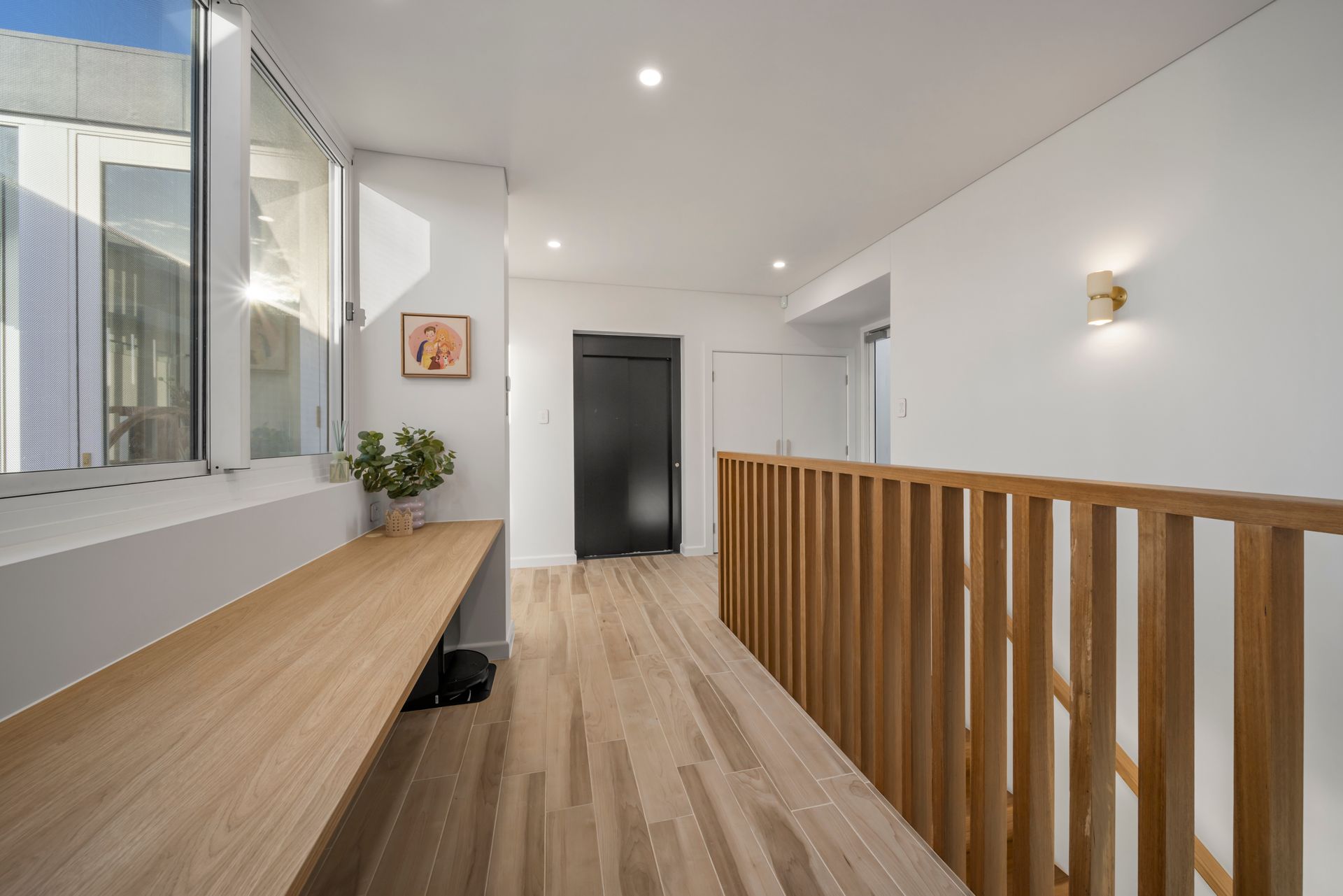 Bright Hallway With Wood Floor, Long Bench, Railing — Simon Bell Constructions in Alice River, QLD