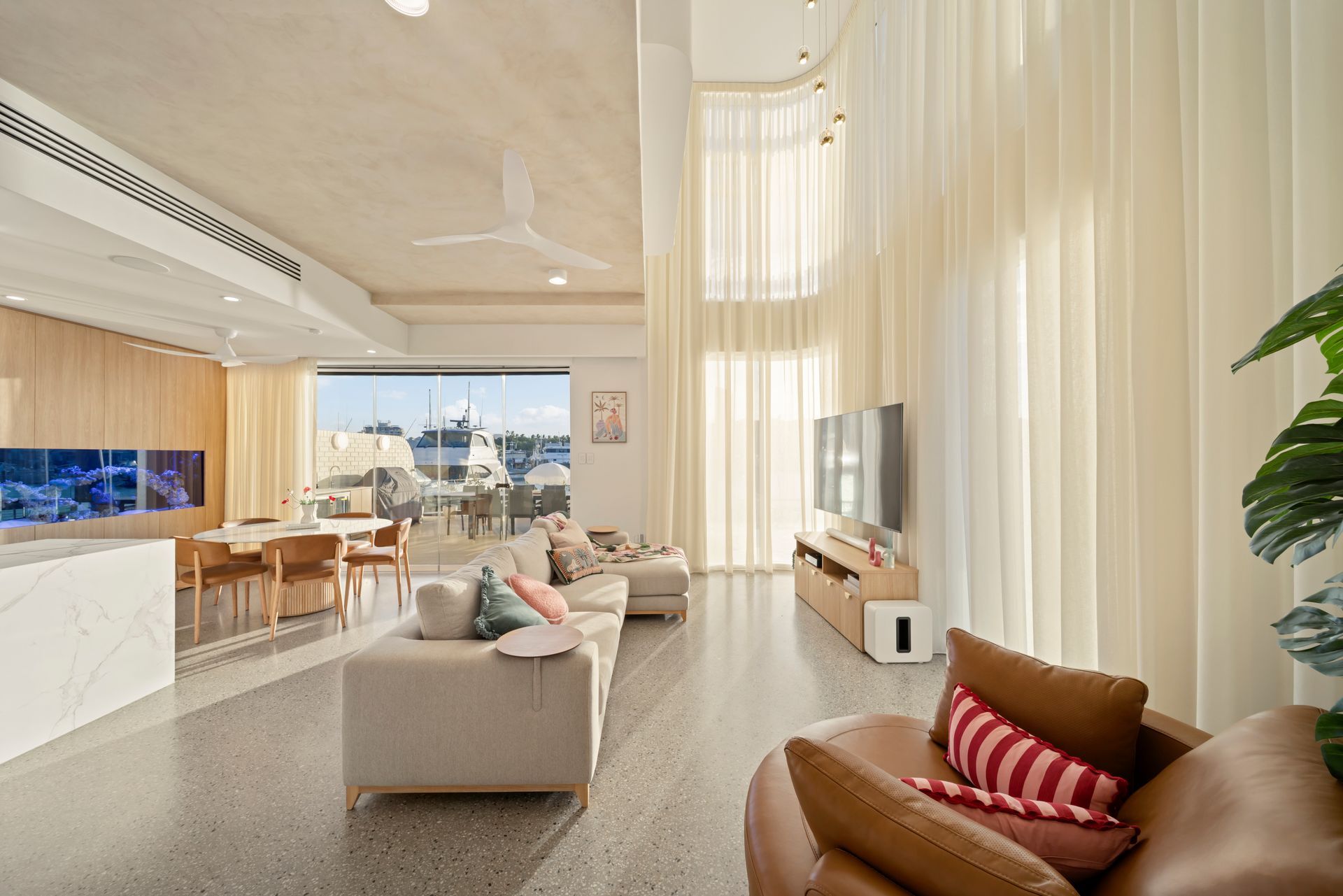 Bright Modern Living Room With Beige Sofas, Tall Windows — Simon Bell Constructions in Alice River, QLD
