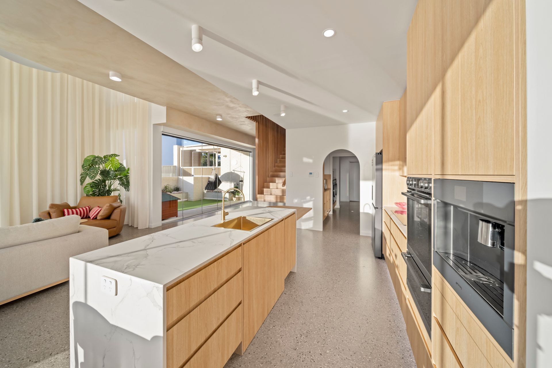Bright Modern Kitchen With Wood Cabinetry — Simon Bell Constructions in Alice River, QLD