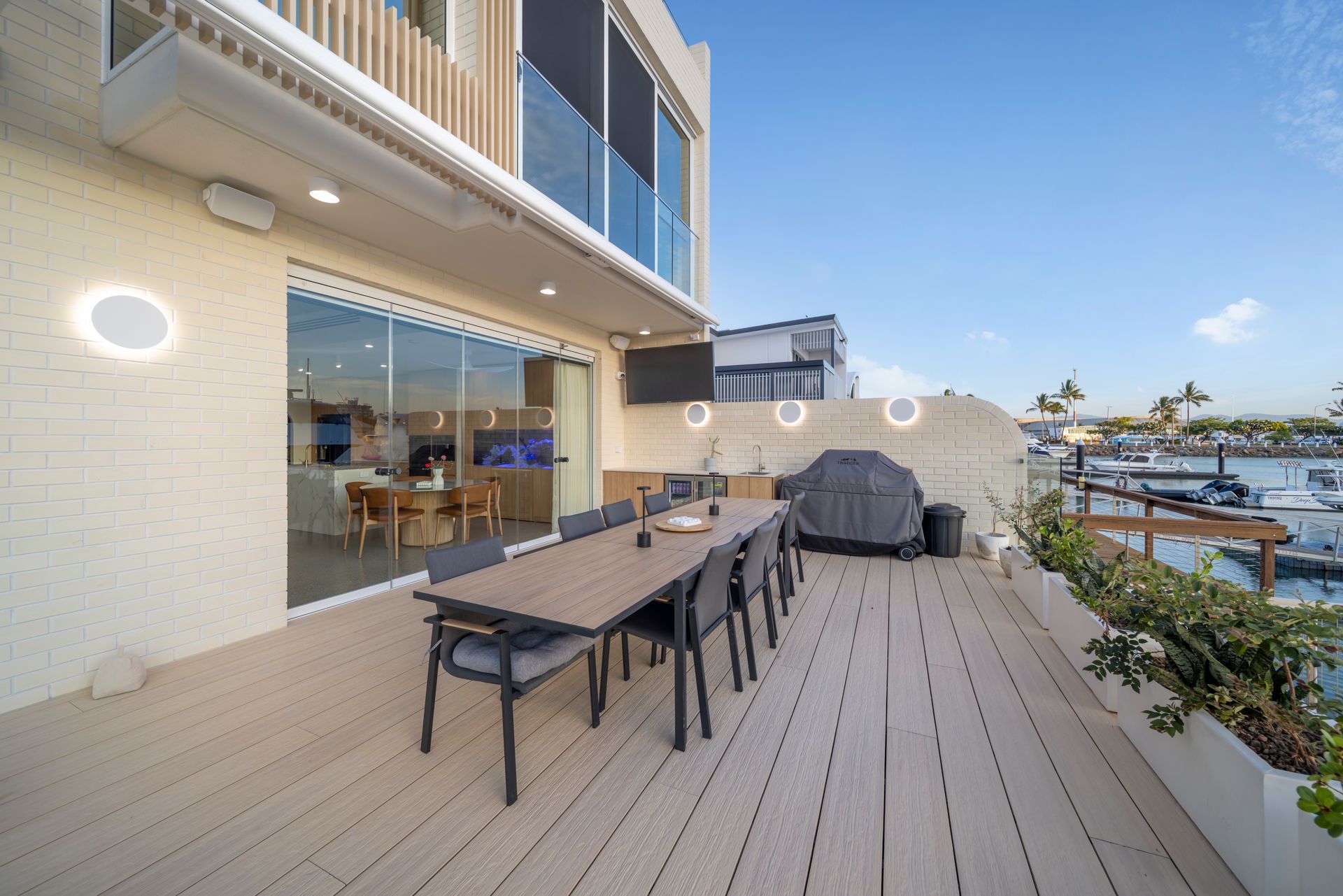 Outdoor Waterfront Deck With Dining Table — Simon Bell Constructions in Alice River, QLD