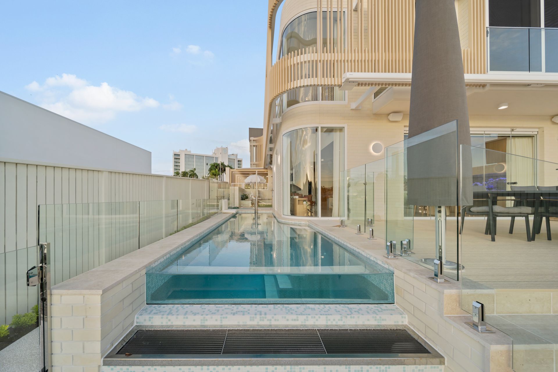 Modern Rooftop Pool With Glass Railings — Simon Bell Constructions in Alice River, QLD