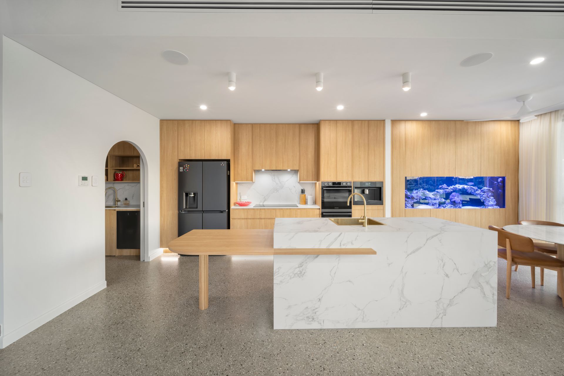 Modern Open-plan Kitchen With Wood Cabinets — Simon Bell Constructions in Alice River, QLD