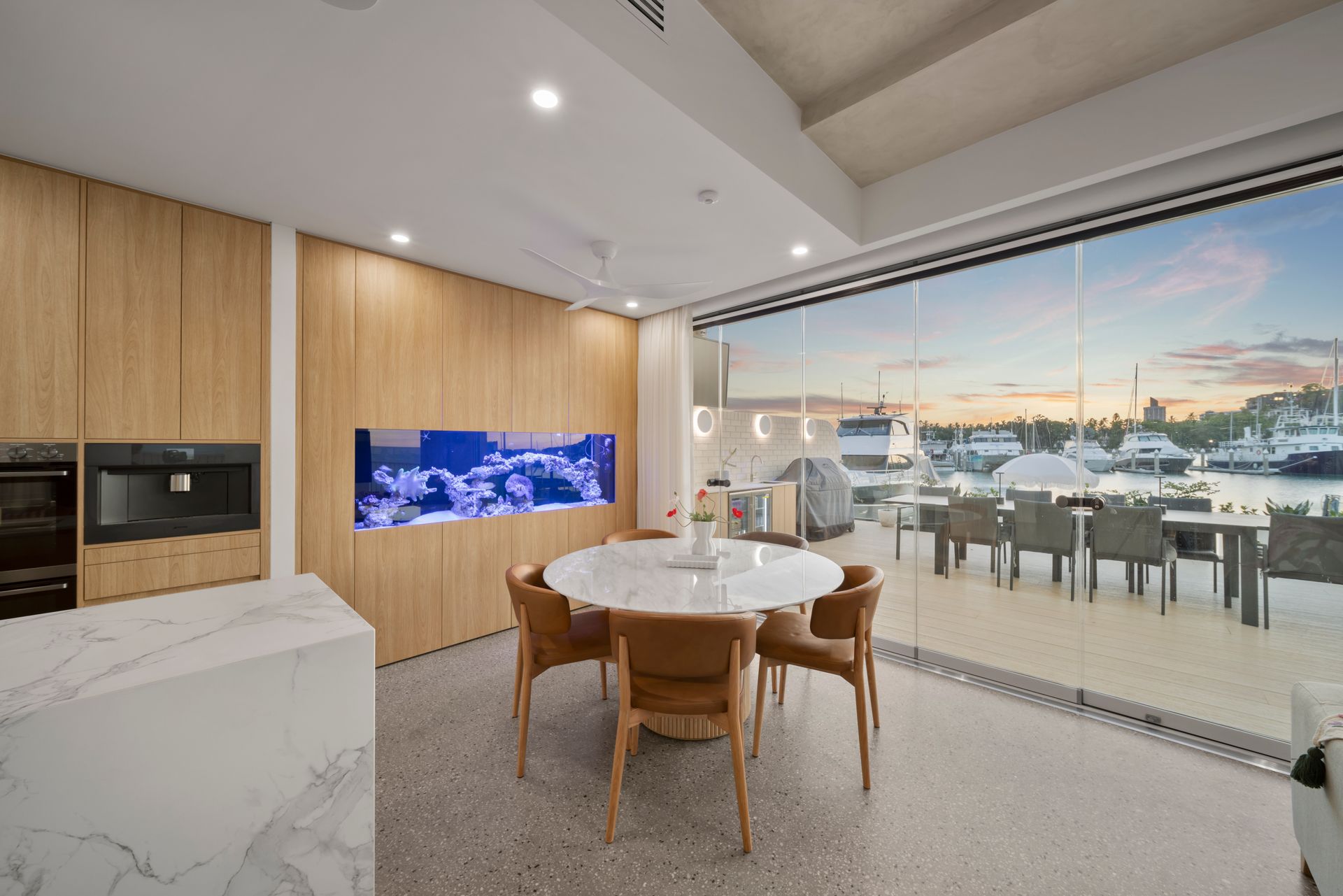 Modern Kitchen-dining Area With Wood Cabinets — Simon Bell Constructions in Alice River, QLD