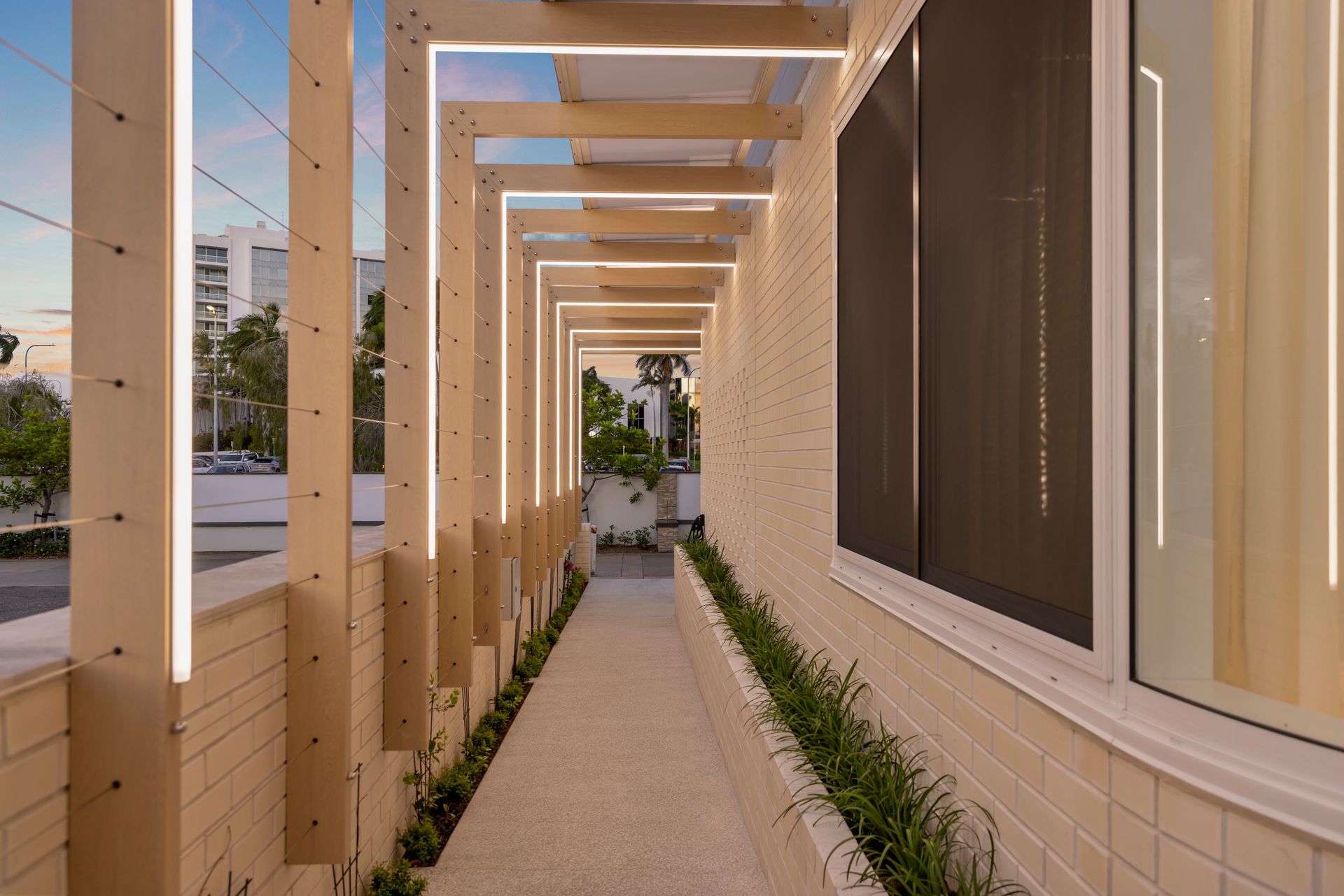 Covered Walkway Beside a Beige Building — Simon Bell Constructions in Alice River, QLD