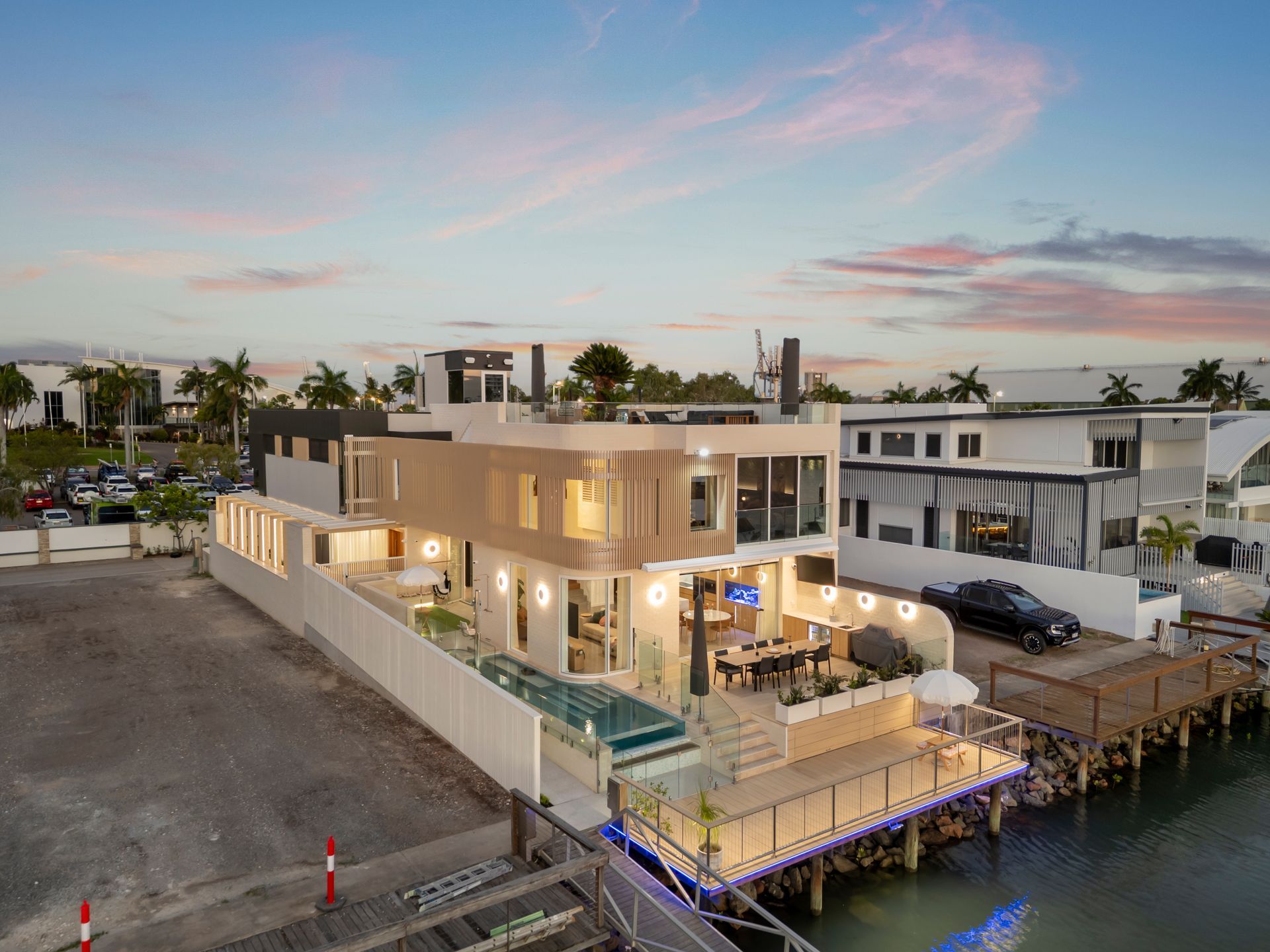 Waterfront Modern Home at Dusk — Simon Bell Constructions in Alice River, QLD