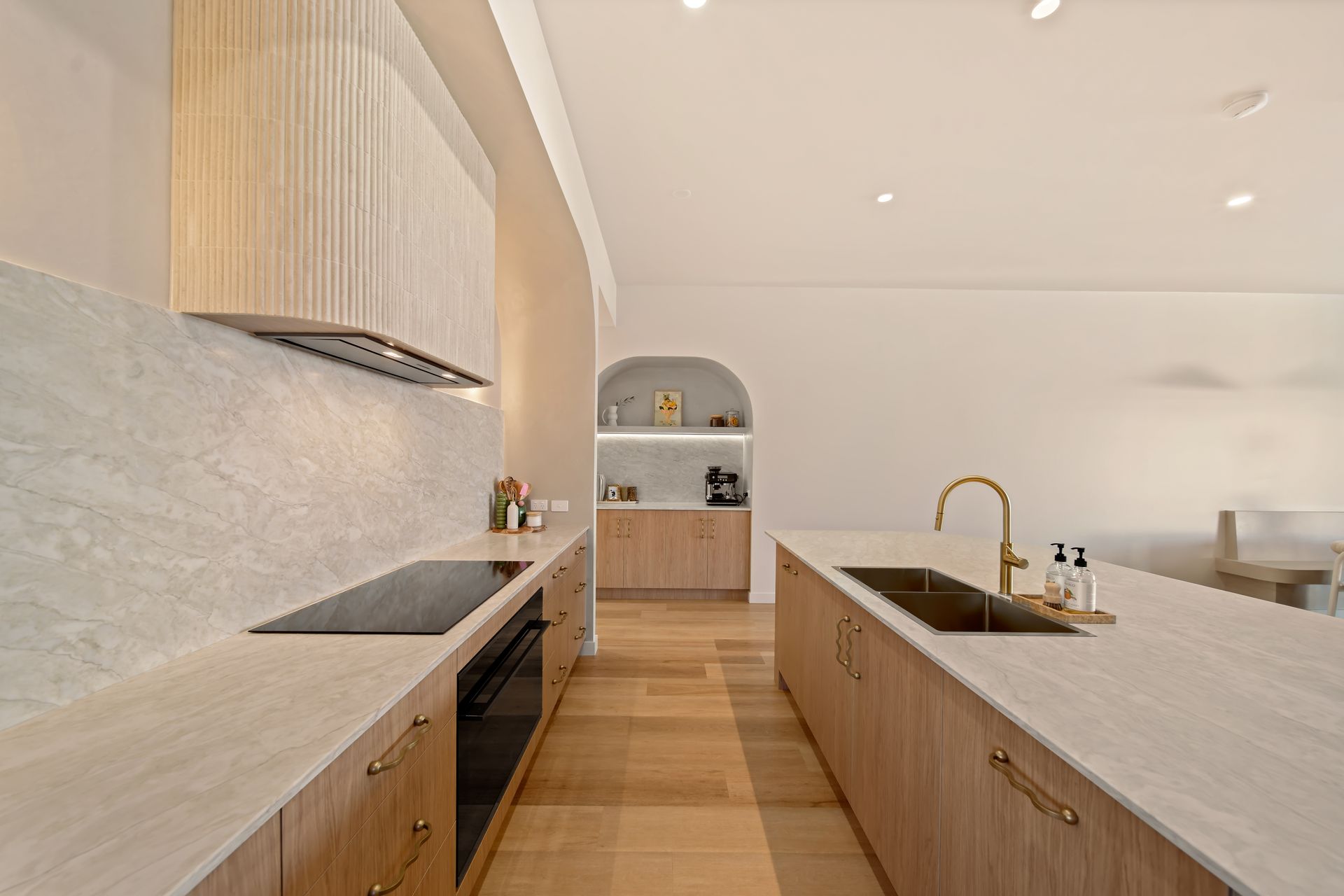 Modern Minimalist Kitchen With Wood Cabinetry — Simon Bell Constructions in Alice River, QLD