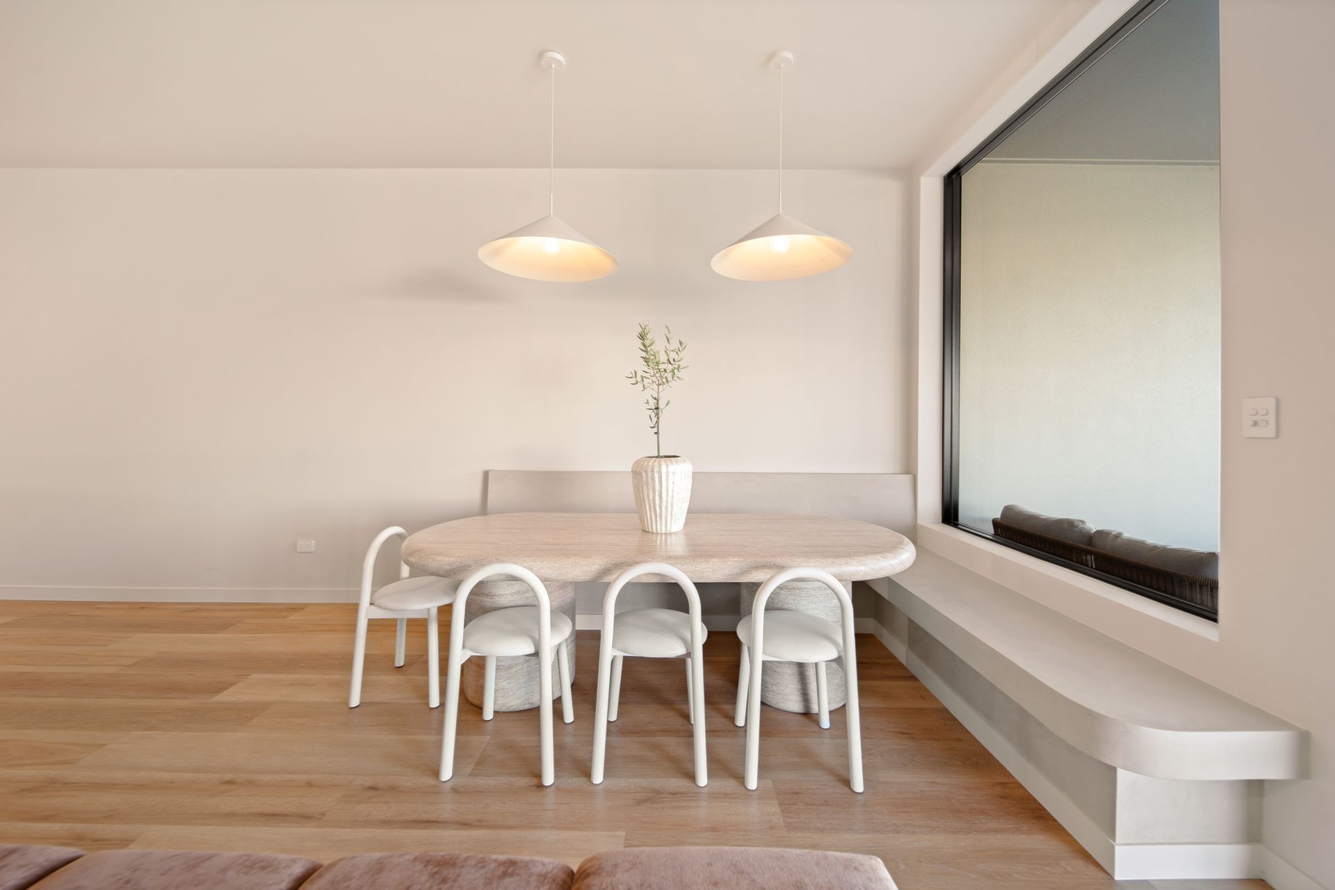Minimalist Dining Room With White Table, Chairs — Simon Bell Constructions in Alice River, QLD
