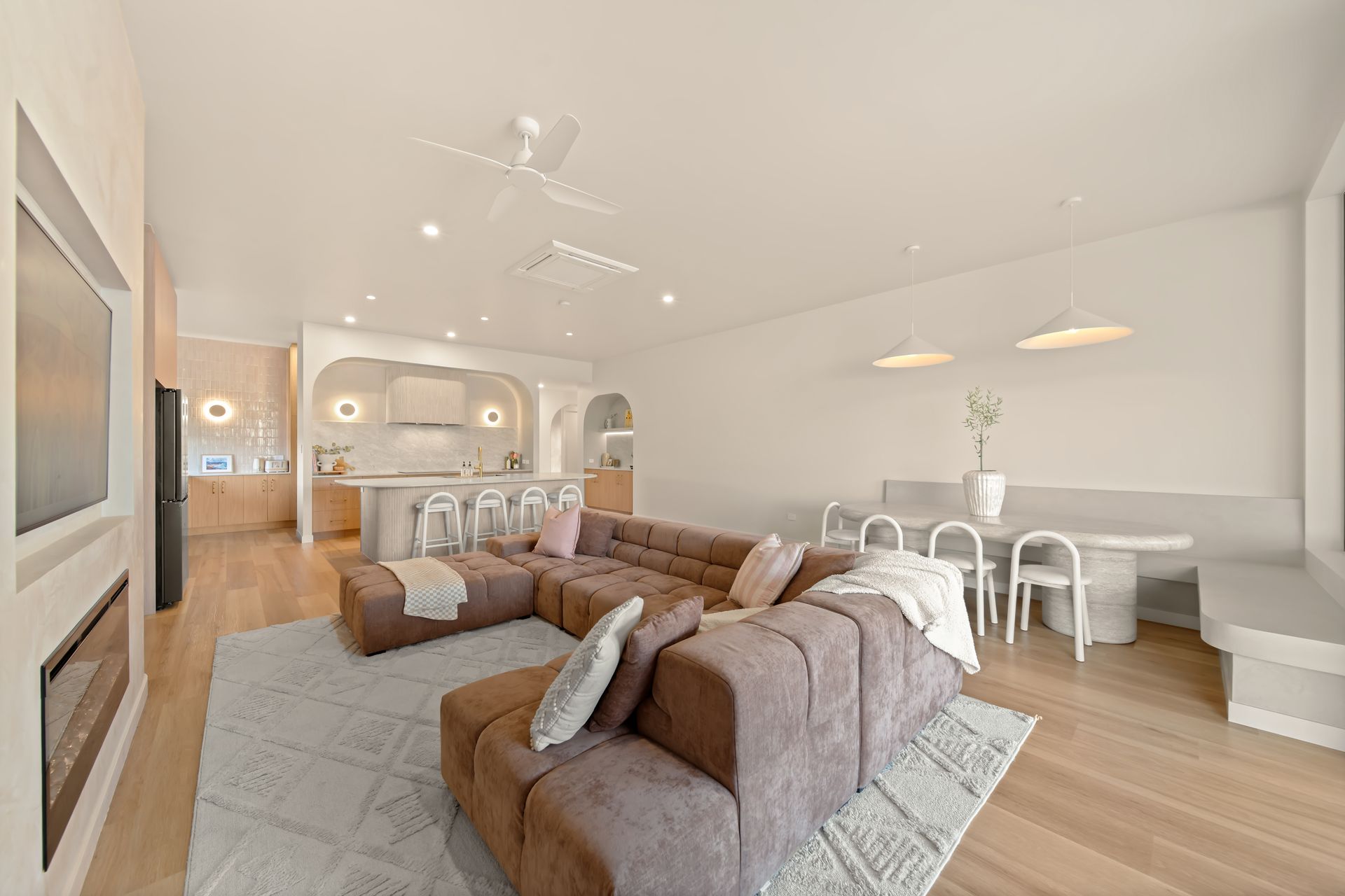 Bright Open-plan Living Room With Brown Sofas — Simon Bell Constructions in Alice River, QLD