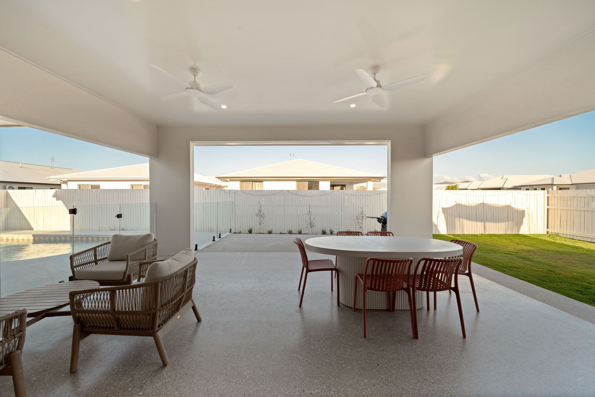 Covered Patio With Outdoor Dining Table, Lounge Chair — Simon Bell Constructions in Alice River, QLD