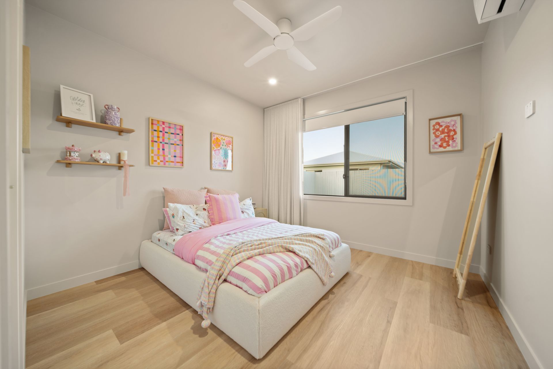 Bright Bedroom With a White Bed, Pastel Bedding — Simon Bell Constructions in Alice River, QLD