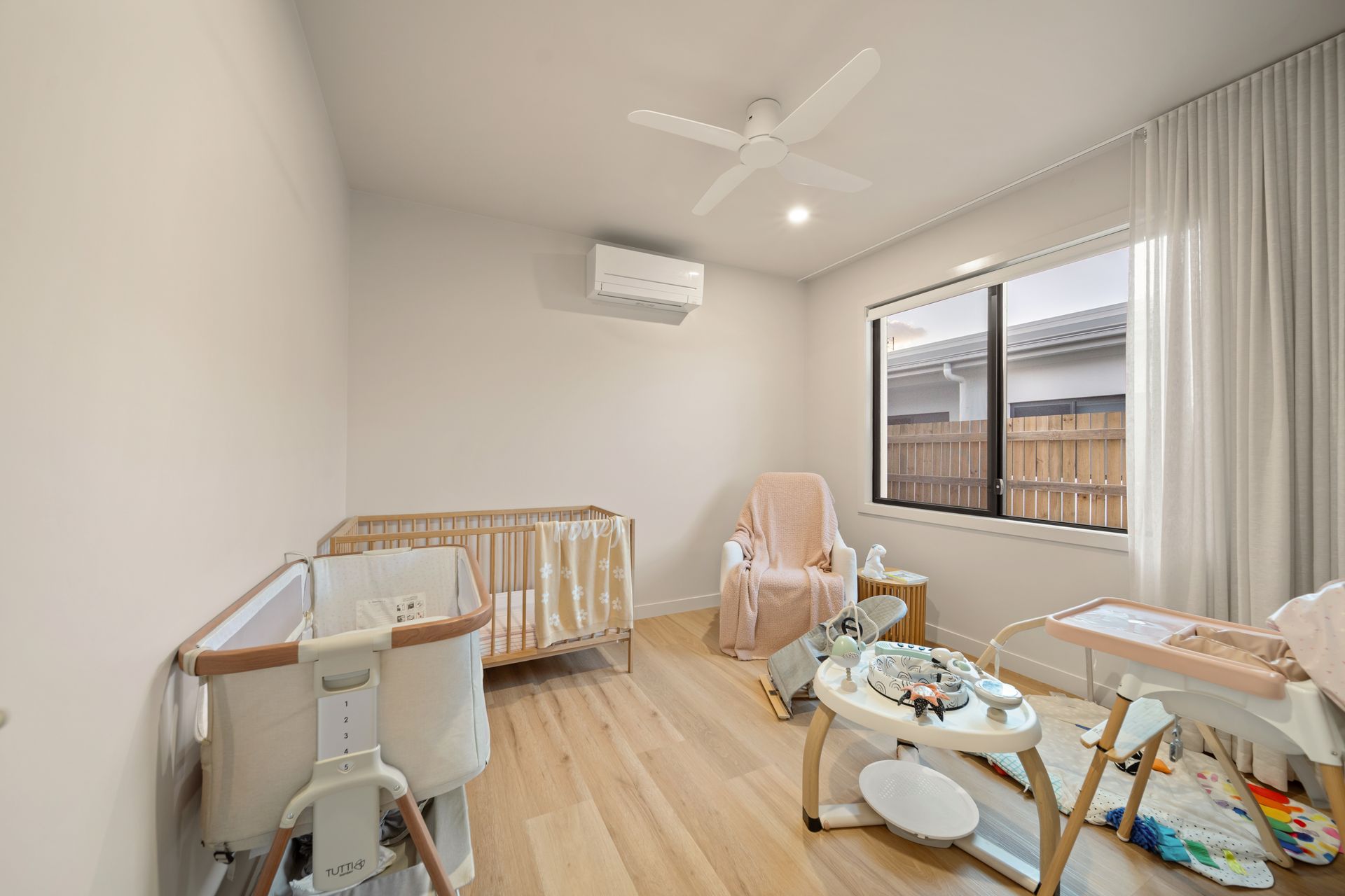 Bright Nursery With Crib, Rocking Chair, Changing Table — Simon Bell Constructions in Alice River, QLD