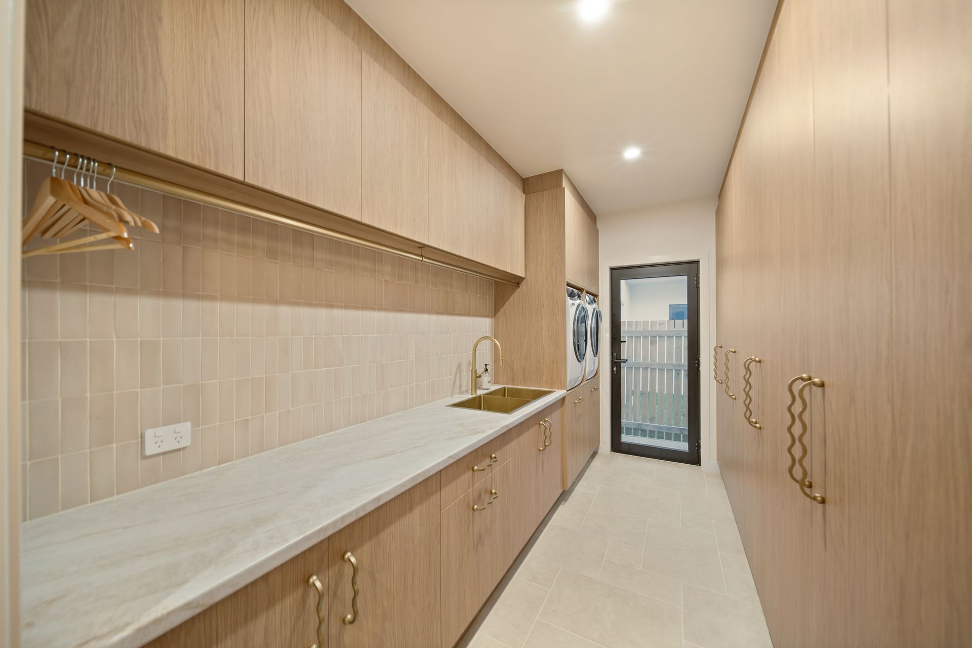 Long Narrow Walk-in Closet With Light Wood Cabinetry, Open Shelves — Simon Bell Constructions in Alice River, QLD