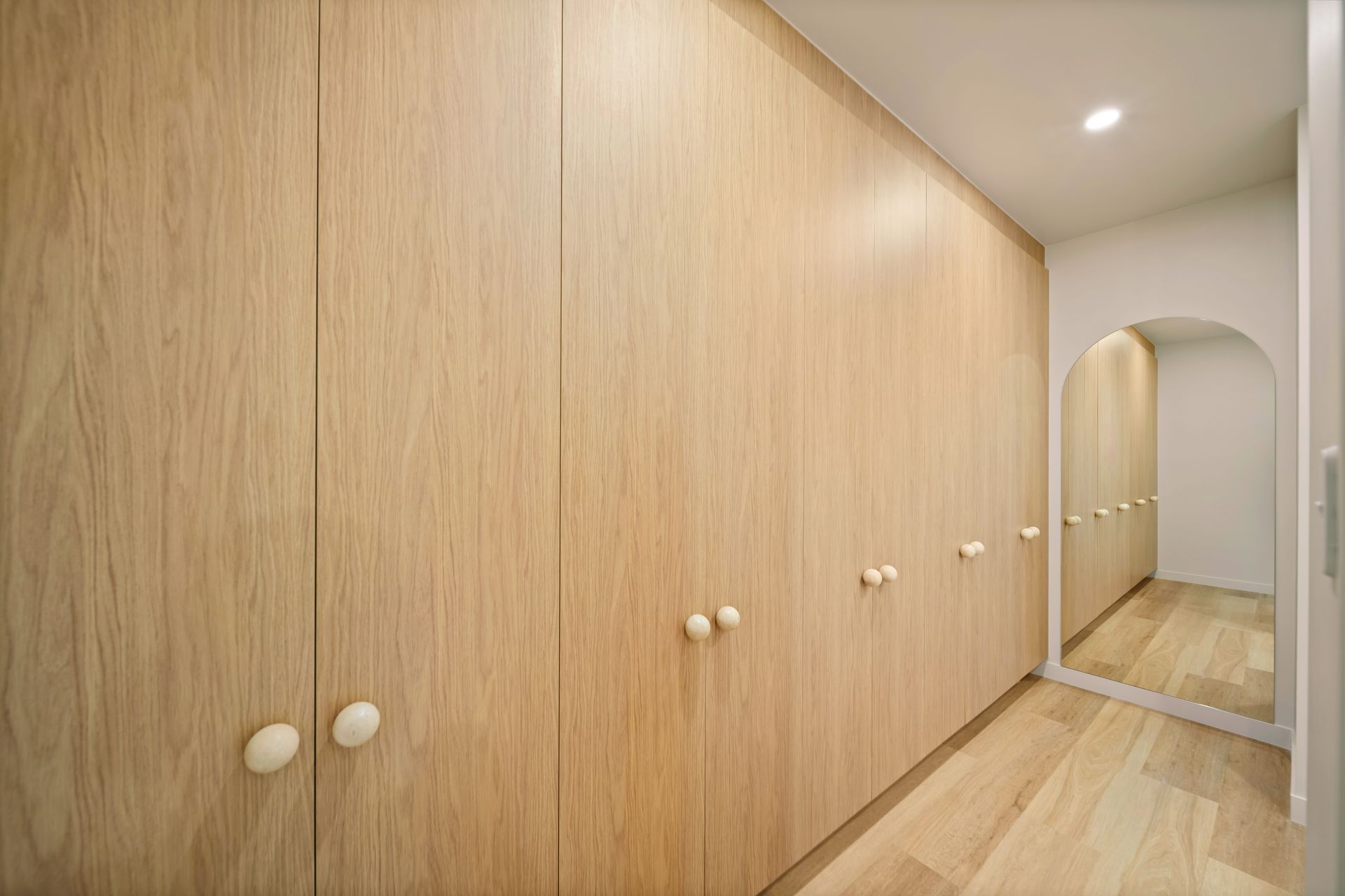 Wood-Paneled Hallway With Built-in Cabinets — Simon Bell Constructions in Alice River, QLD