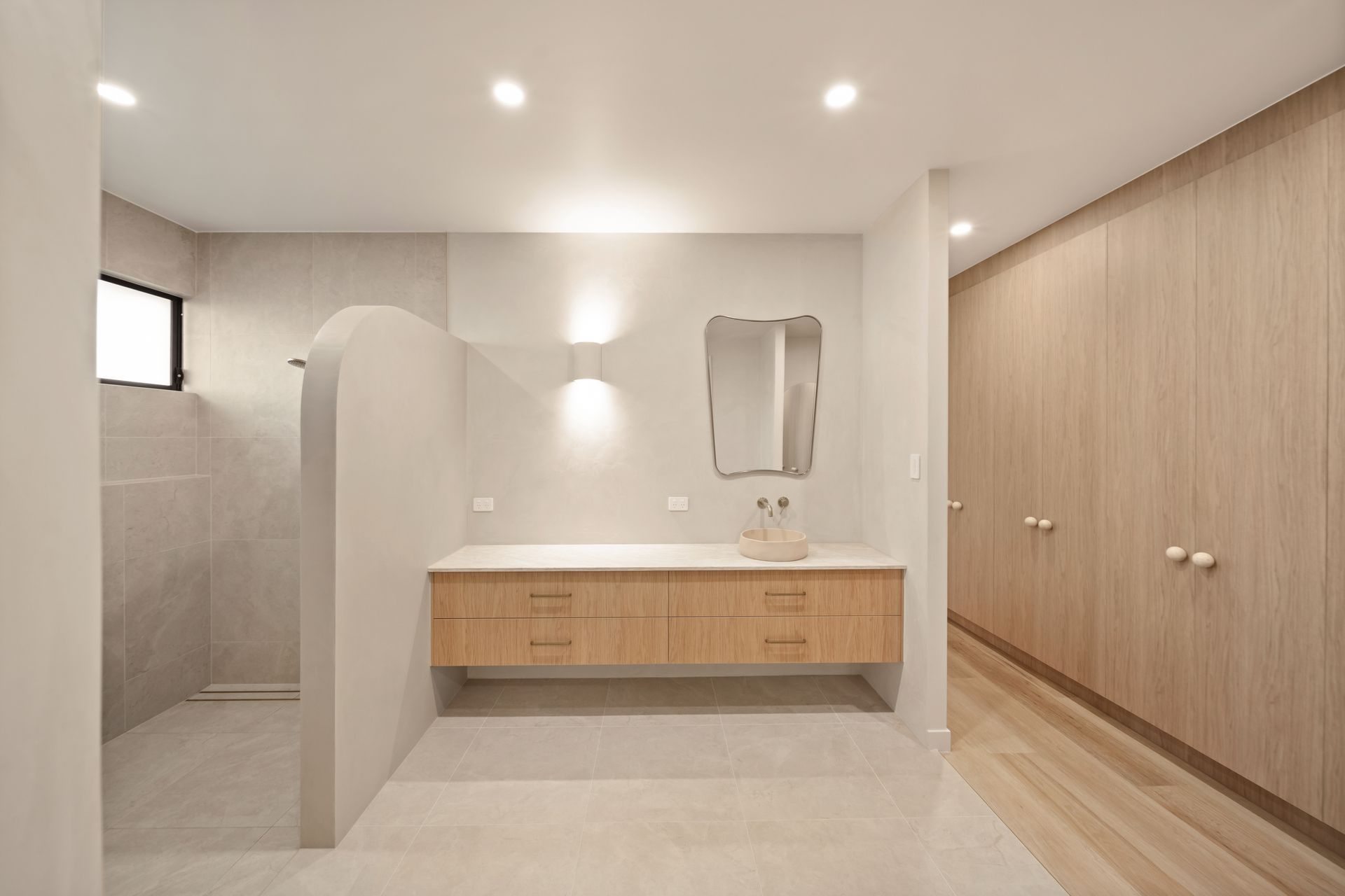 Modern Bathroom With Wood Vanity, Wall Mirror — Simon Bell Constructions in Alice River, QLD