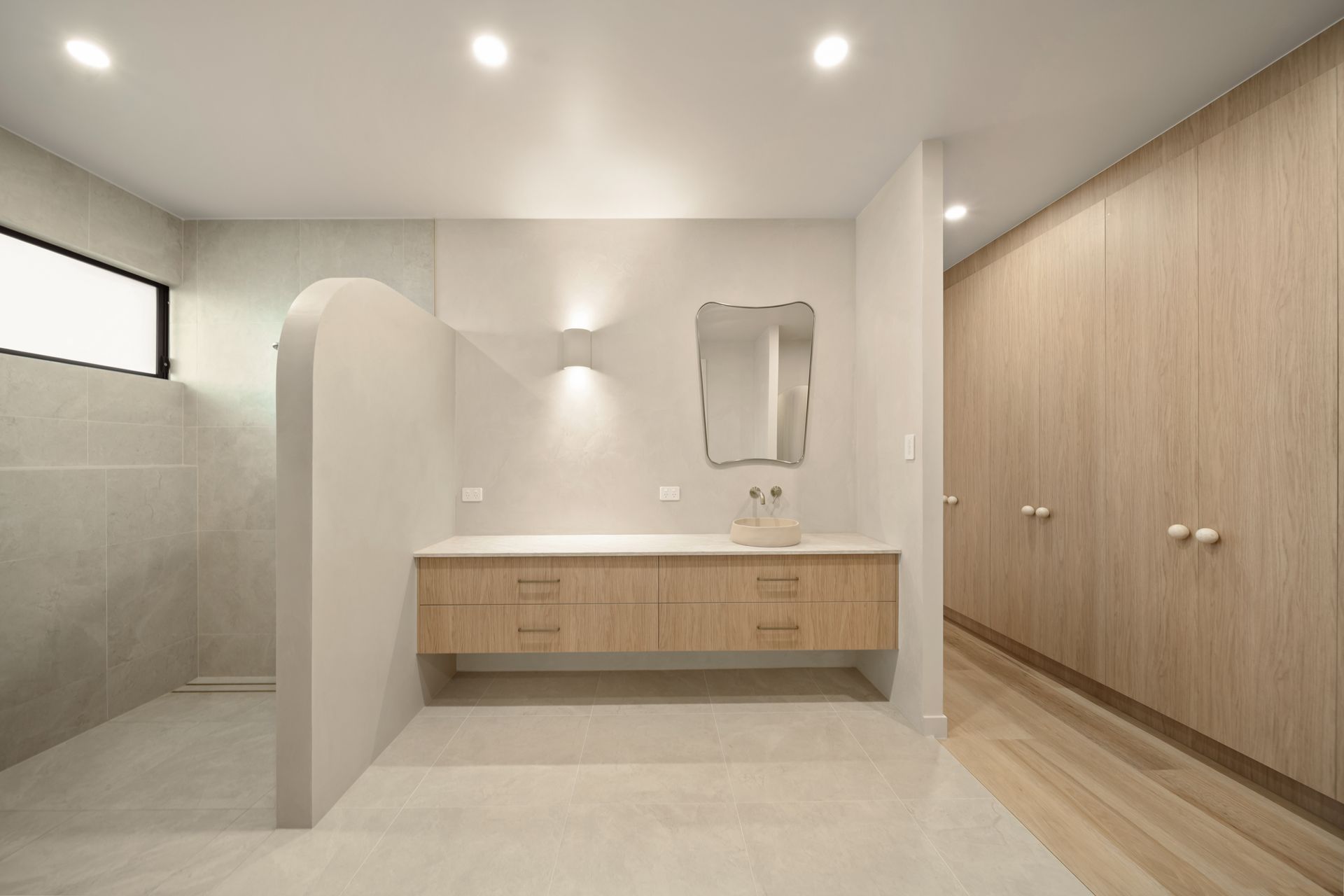 Modern Minimalist Bathroom With Wood Vanity, Large Mirror — Simon Bell Constructions in Alice River, QLD